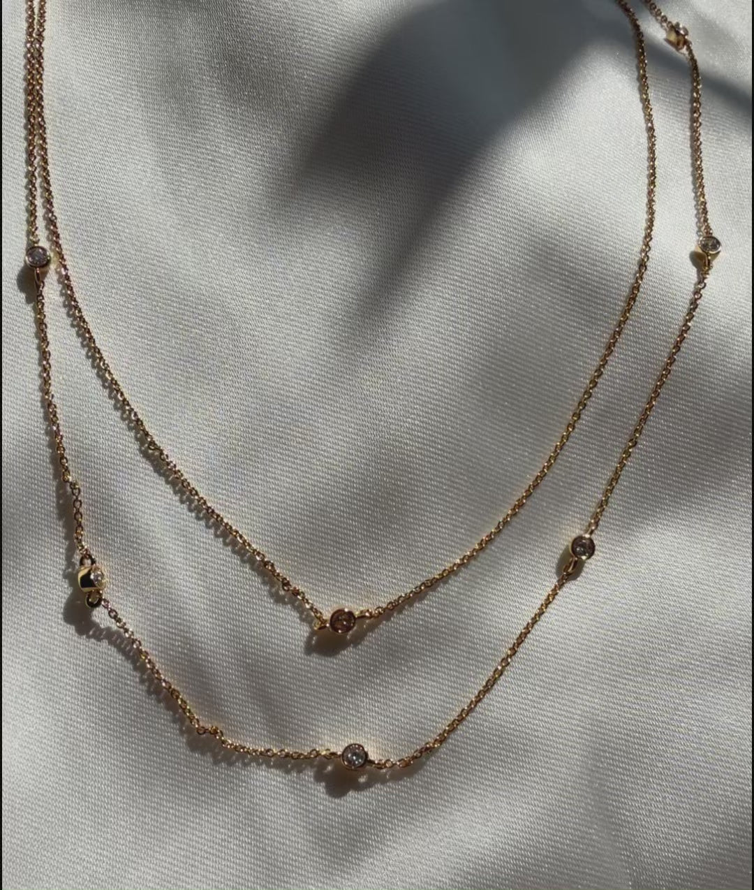 Two-chain layered bezel stations diamonds dimensional presentation