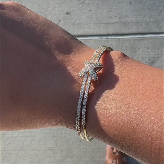 Intersecting diamond rows flexible cuff fashion presentation