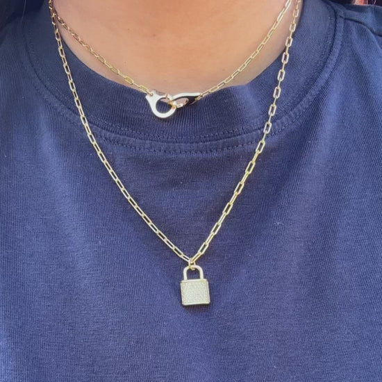 Paper Clip Necklace with Handcuff Charm on display showcasing industrial-chic