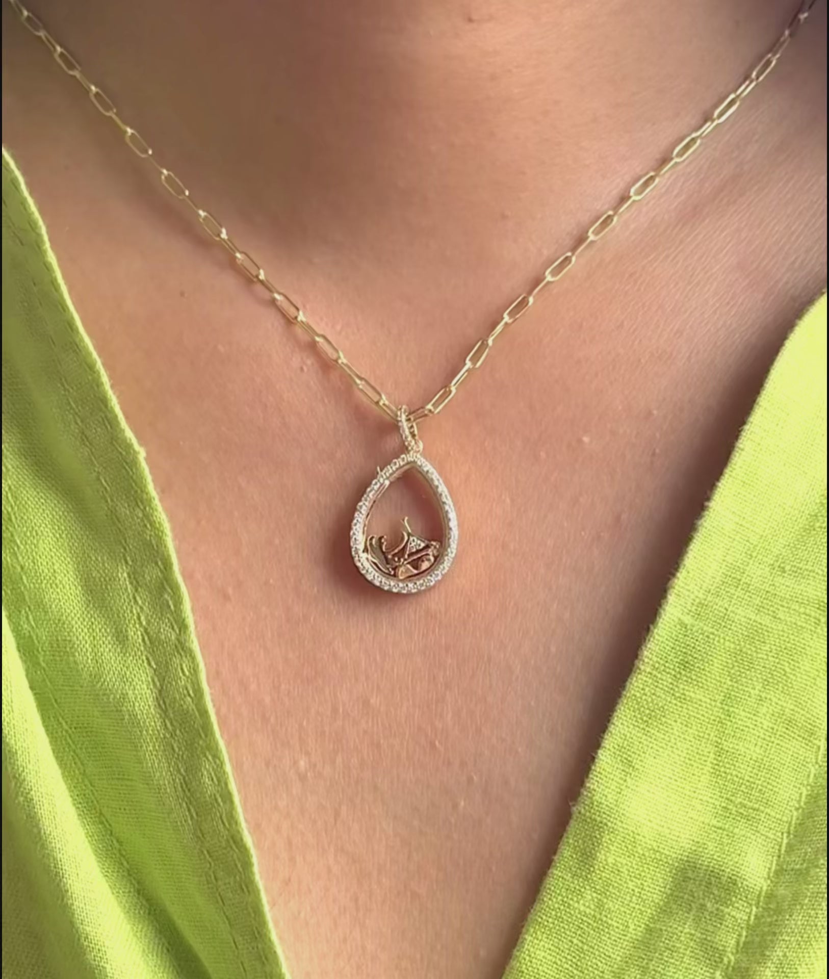 Diamond pear shape glass locket charm lifestyle shot displaying wearable elegance