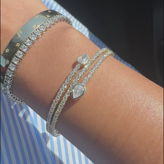 Scattered diamond bangle fashion accessory presentation