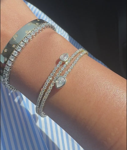 Scattered diamond bangle fashion accessory presentation