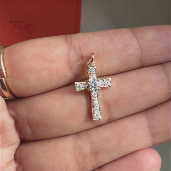Sacred cross charm substantial diamonds fashion presentation