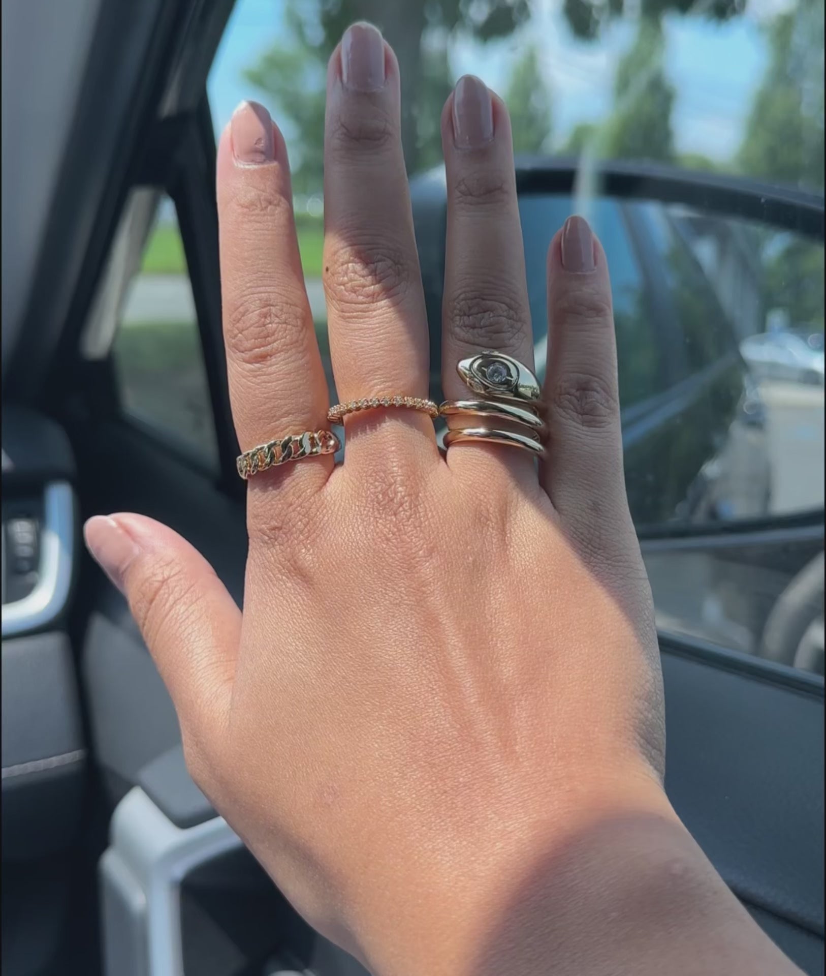 Diamond Snake Swirl Ring on finger capturing sinuous movement and mystical elegance