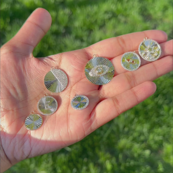 Evil eye charm diamond outline fluted circle fashion presentation