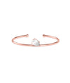 Rose gold open cuff bracelet featuring a pear-shaped diamond solitaire in prong setting