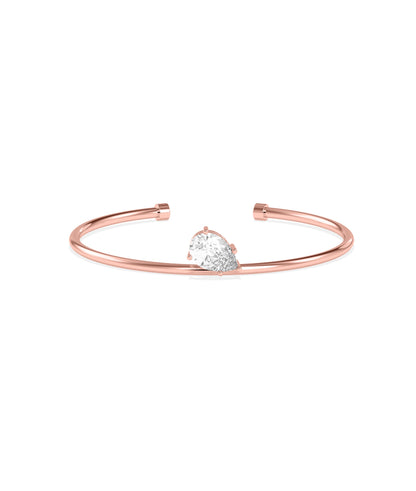 Rose gold open cuff bracelet featuring a pear-shaped diamond solitaire in prong setting