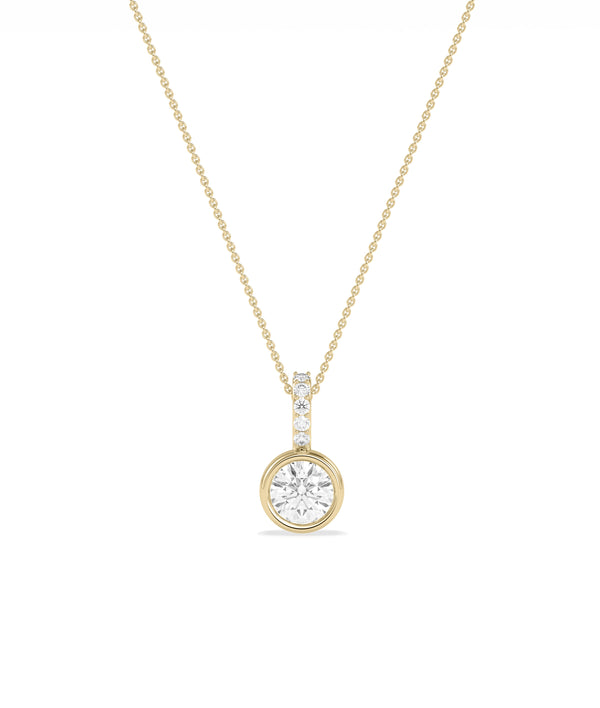 Round bezel solitaire diamond charm pendant in yellow gold