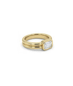 Solitaire bezel double band ring in 14K yellow gold side profile view