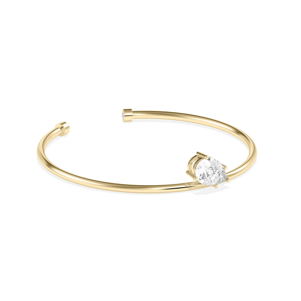 Side profile of solitaire pear lab diamond cuff bangle in 14K yellow gold alternate view