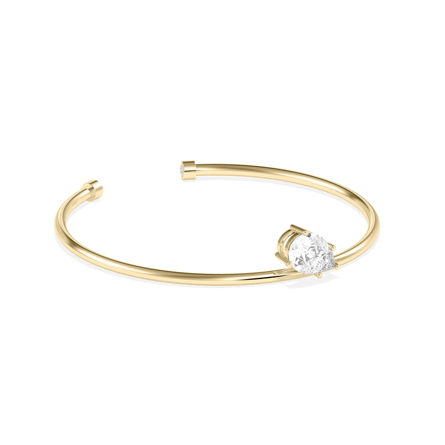 Side profile of solitaire pear lab diamond cuff bangle in 14K yellow gold