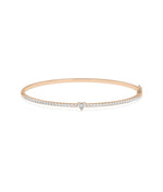 Straight line diamond bangle with solitaire in 14K rose gold