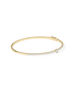 Straight line diamond bangle with solitaire in 14K yellow gold, side view