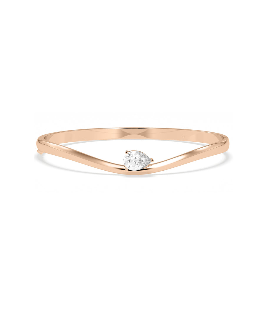 Wave solitaire diamond bangle in 14K rose gold