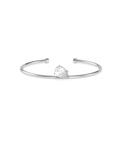 White gold open cuff bangle bracelet with a heart-shaped diamond cluster centerpiece